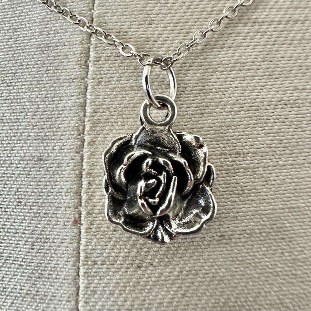 Silver tone rose pendant necklace
